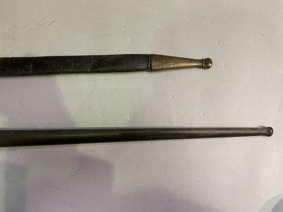 Saber and dagger with leather and brass scabbards
66...