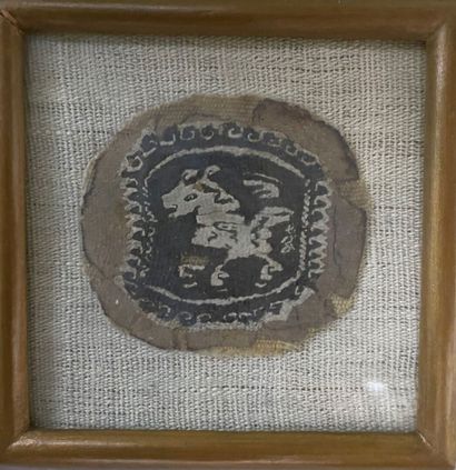 Three fragments of fabric representing animals...