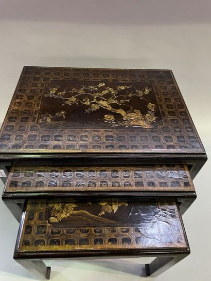 Three nesting tables in lacquer decorated...