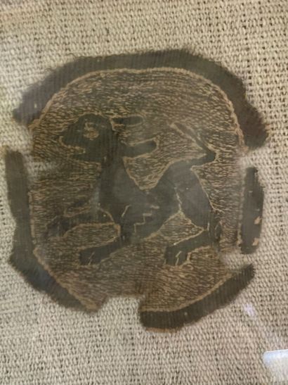 Three fragments of fabric representing animals...