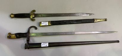 Saber and dagger with leather and brass scabbards
66...