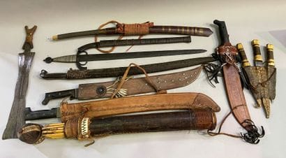 Large lot of swords, daggers, machetes, quivers...