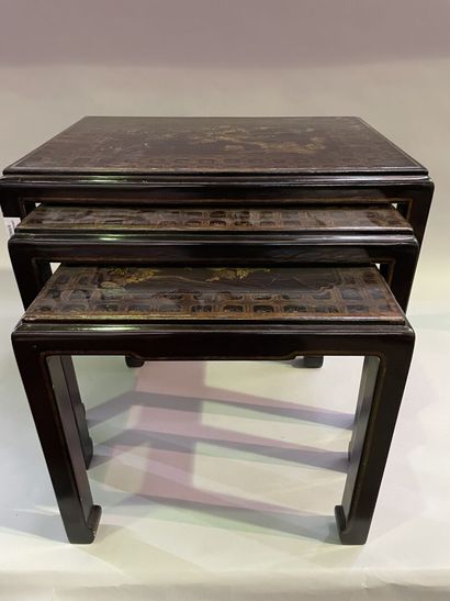 Three nesting tables in lacquer decorated...