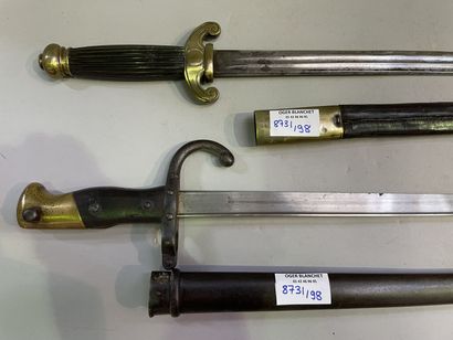 Saber and dagger with leather and brass scabbards
66...