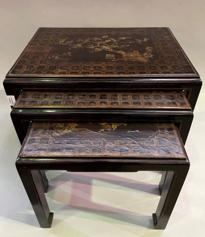 Three nesting tables in lacquer decorated...