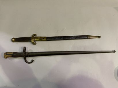 Saber and dagger with leather and brass scabbards
66...