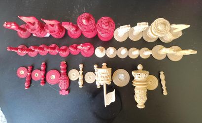 Carved and stained ivory chess set including...