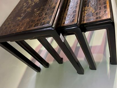 Three nesting tables in lacquer decorated...