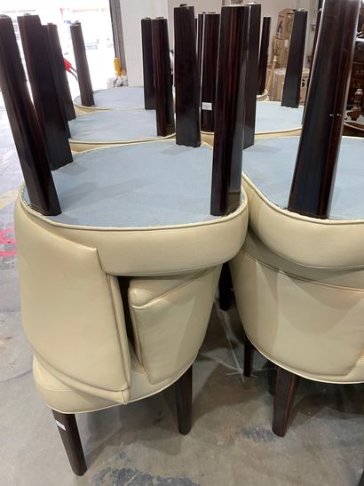 Four dining room tables with varnished wood...