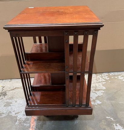 Revolving bookcase in stained wood. 
Beginning...