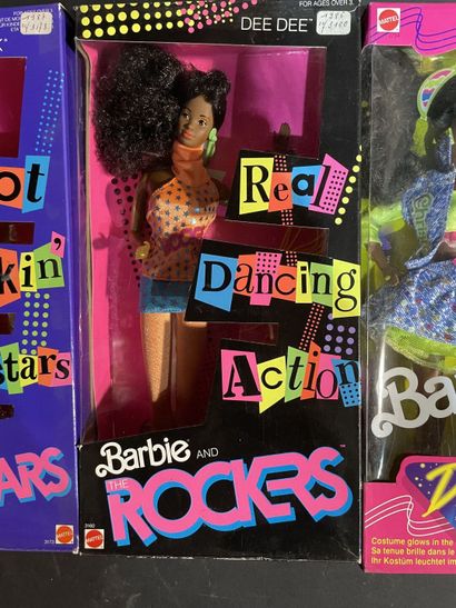 Five Mattel Barbie dolls: two rock stars...