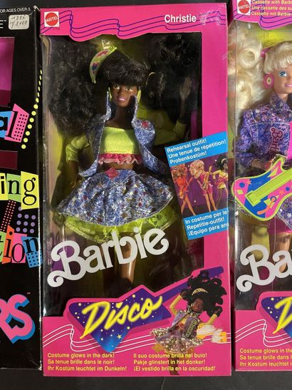 Five Mattel Barbie dolls: two rock stars...