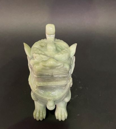 Carved light green jadeite Dog of Fô.
20th...