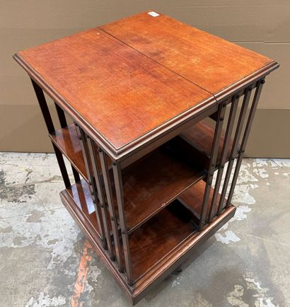 Revolving bookcase in stained wood. 
Beginning...