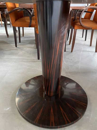Four dining room tables with varnished wood...
