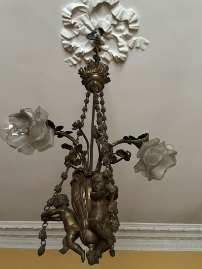 Bronze chandelier decorated with lovers holding...