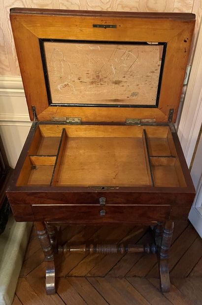 Two working tables opening to a drawer and...
