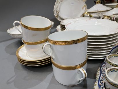 Part of a porcelain dinner service with gilded...