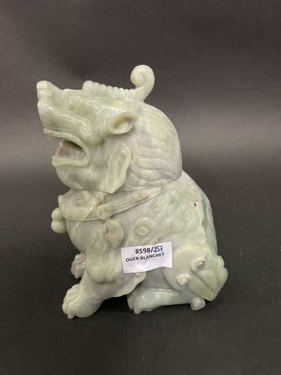 Carved light green jadeite Dog of Fô.
20th...