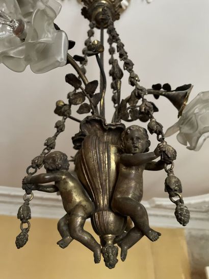 Bronze chandelier decorated with lovers holding...