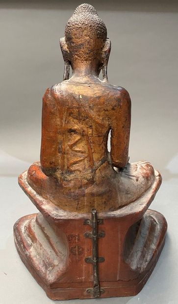 Seated Buddha in carved and gilded wood,...