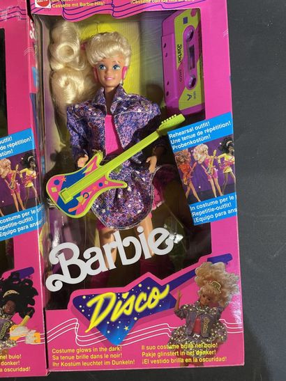 Five Mattel Barbie dolls: two rock stars...