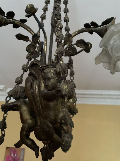 Bronze chandelier decorated with lovers holding...