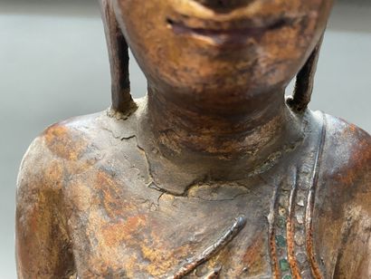 Seated Buddha in carved and gilded wood,...