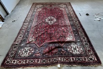 Berber carpet with red background and blue...
