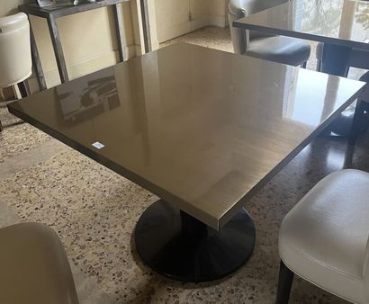 Four dining room tables with varnished wood...