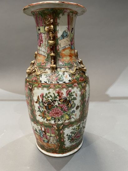 A Canton porcelain baluster vase decorated...