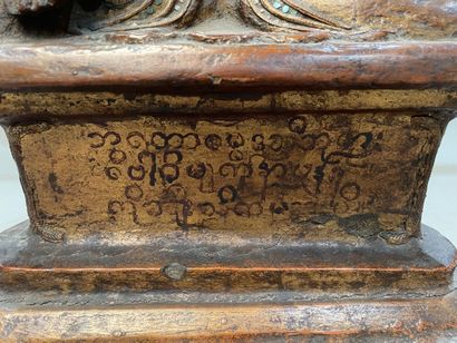 Seated Buddha in carved and gilded wood,...