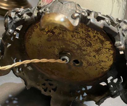 Two ceramic lamp bases, one with grotesque...