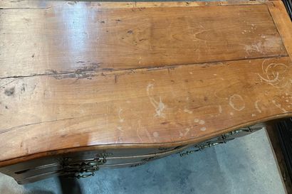 Walnut chest of drawers with curved front...