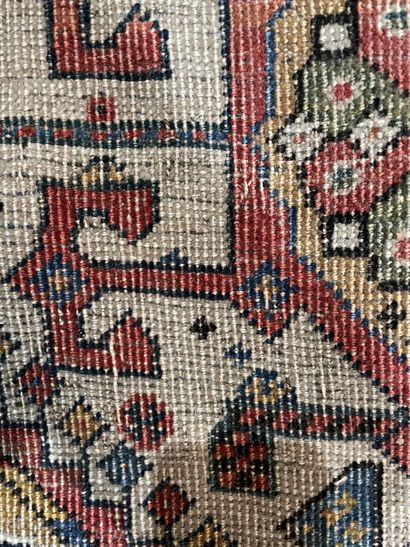 Woolen carpet decorated with three lacy lozenges...