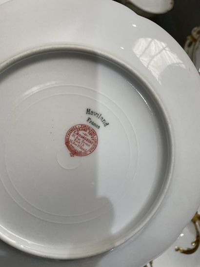 Part of a porcelain dinner service with gilded...