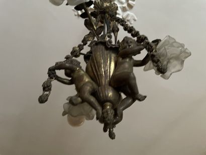 Bronze chandelier decorated with lovers holding...