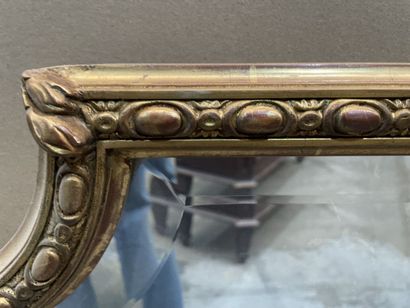 Oblong mirror in wood and gilded stucco decorated...