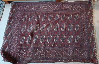 Woolen carpet with red background and decoration...