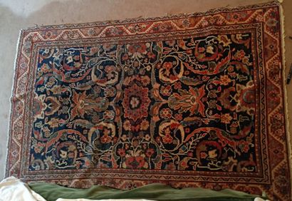 Wool carpet decorated with polychrome scrolls...