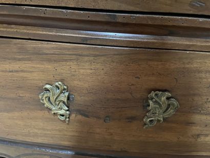 Walnut chest of drawers opening to four drawers...