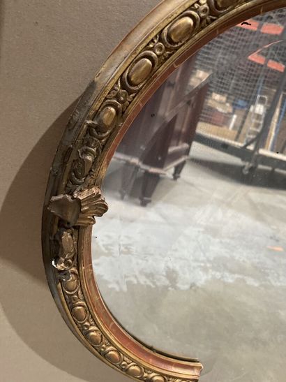 Oblong mirror in wood and gilded stucco decorated...