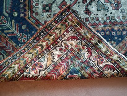 Woolen carpet decorated with three lacy lozenges...