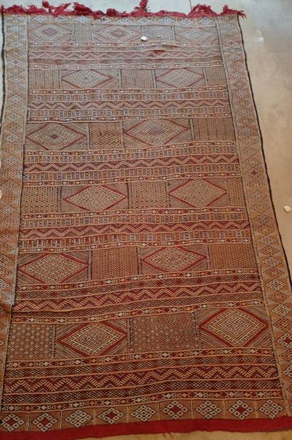 A Moroccan carpet.
233 x 142 cm.
Wear and...