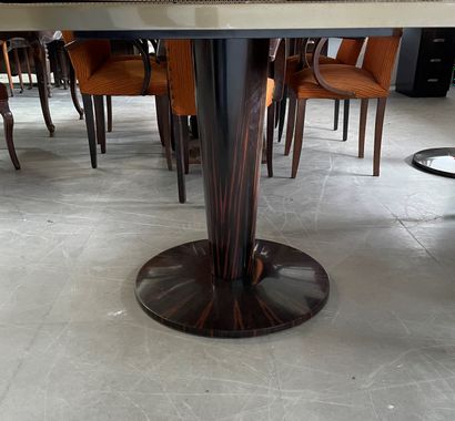 Four dining room tables with varnished wood...