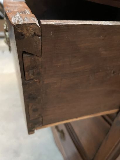 Walnut chest of drawers opening to four drawers...