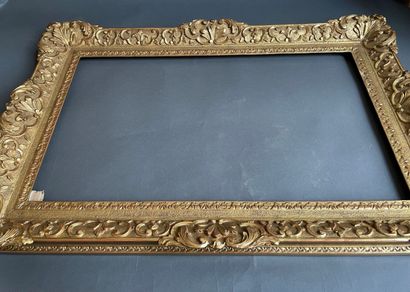 A berain frame in gilded wood carved with...