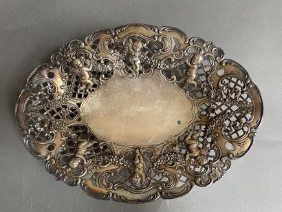 Oval silver basket, chased with lilies holding...