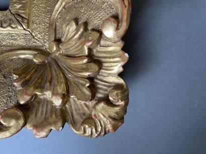 A berain frame in gilded wood carved with...
