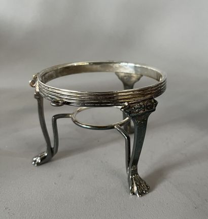 English silver-plated teapot on stove with...